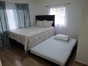 Postel nebo postele na pokoji v ubytování Relax Inhouse + 4 fotografie