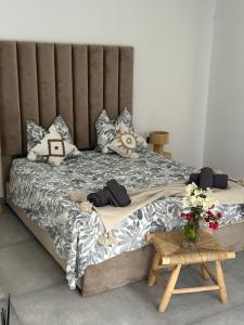 a large bed in a room with flowers on it at Villa Lam in Marrakech +21 photos