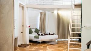 Postel nebo postele na pokoji v ubytování Trisara Boutique Stay