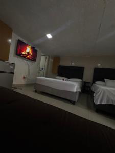 En eller flere senge i et værelse på Habitación corales cerca al mar