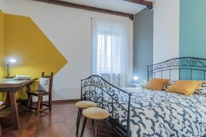 Ένα ή περισσότερα κρεβάτια σε δωμάτιο στο Al Civico 11, nel cuore della piazza principale di Lainate, minimal e confortevole, comodo per Rho Fiera Milano