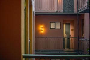 a view of a balcony with a light on the wall at Pandora House in Mexico City +25 photos