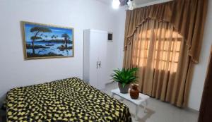 En eller flere senge i et værelse på Quartos privativo perto da praia de Itaparica