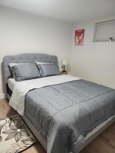 En eller flere senge i et værelse på Oasis Haven