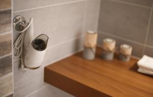a bathroom with a counter with some candles on it at Penzion Recall in Troskovice