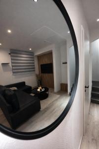 Posezení v ubytování Magnifique Logement indépendant 5 min Colmar parking wifi + 5 fotografií