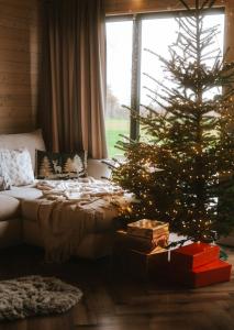 Postel nebo postele na pokoji v ubytování Wood House Trzęsacz