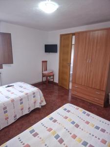 Postel nebo postele na pokoji v ubytování Fogar do Gabino