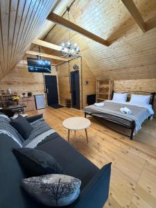a large room with a bed and a table at Debed View in Debed