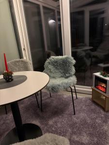 a room with a table and a chair and a window at Studio apartma Rimljanka in Ptuj