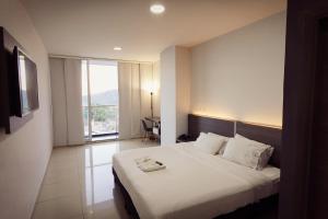 Postel nebo postele na pokoji v ubytování Hotel Doral Inn + 29 fotografií