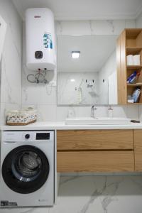 Kuchyň nebo kuchyňský kout v ubytování Boho Central Apartment