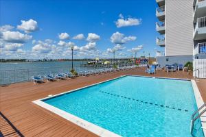 a swimming pool on the deck of a cruise ship at Amazing Bay view from this Assateague House Condo in Ocean City