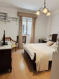 Giường trong phòng chung tại Julia Home, habitaciones en casa de un particular