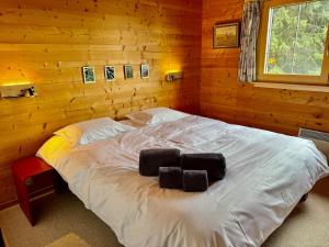 En eller flere senge i et værelse på S 4 4 Chalet Familial 10pax