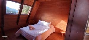 En eller flere senge i et værelse på Chalet MA