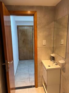a bathroom with a shower and a sink at Loft Rio - Ideal turismo - Opcion a cochera! in Rosario