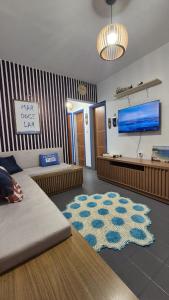 Et tv og/eller underholdning på Ap Beach House 001 - Cond Cais da Sagração - Angelim