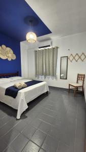 En eller flere senge i et værelse på Ap Beach House 001 - Cond Cais da Sagração - Angelim