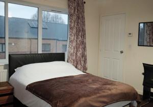 En eller flere senge i et værelse på Home in Birmingham City Centre