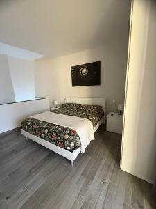 a bedroom with a bed in a room at La Casa del Don in Capua