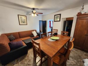 a living room with a couch and a dining room table at Casa Vizcaino in Ensenada