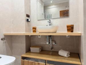 a bathroom with a sink and a mirror at Domus Altiora Centro in Salamanca +31 photos