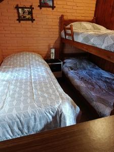 Postel nebo postele na pokoji v ubytování Cabañas Brisa's