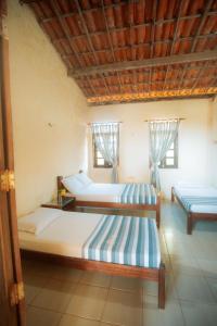 Un pat sau paturi într-o cameră la Pousada Doromari +126 fotografii