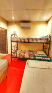 En eller flere senge i et værelse på Sea Garden Mizata