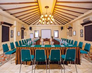 a large conference room with a long table and chairs at Duta Boutique Villa in Yogyakarta +52 photos