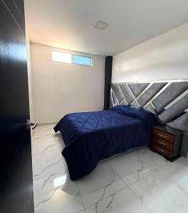 En eller flere senge i et værelse på Jeanael suites 2