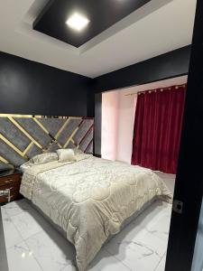 En eller flere senge i et værelse på Jeanael suites 2