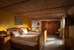 Postel nebo postele na pokoji v ubytování Griesalp Hotels