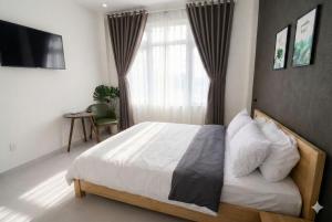 Postel nebo postele na pokoji v ubytování Hello Dalat Hostel