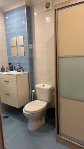 a bathroom with a toilet and a sink at MALÔ - Queluz in Queluz