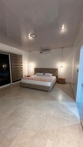 Giường trong phòng chung tại Suite Rosedelco