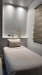 Giường trong phòng chung tại Suite Rosedelco