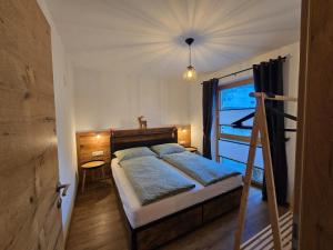 Ένα ή περισσότερα κρεβάτια σε δωμάτιο στο Tauernapart I und II