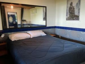 En eller flere senge i et værelse på Callachuchi Homestay