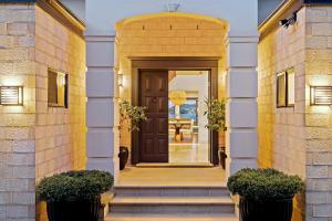 an entrance to a house with a brown door at Waters Edge by Coast Hosting in Koolewong