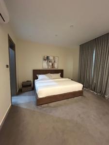 En eller flere senge i et værelse på Kana Apartments + 10 billeder