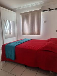 En eller flere senge i et værelse på Apto Gran Village a 4km da Litorânea e 2k do Shopping