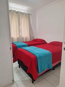 En eller flere senge i et værelse på Apto Gran Village a 4km da Litorânea e 2k do Shopping