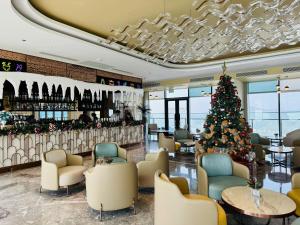 a christmas tree in the lobby of a hotel at A LA CARTE Hạ Long Bay View biển tầng cao in Ha Long