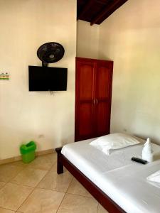 Et tv og/eller underholdning på Hotel Restaurante La Costica Dulce