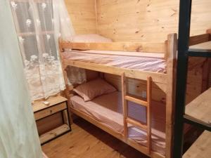 a couple of bunk beds in a room at Los Sosa y Más in Santa Vitória do Palmar
