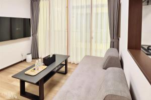 TV a/nebo společenská místnost v ubytování Oita Stay Inn Miyakomachi