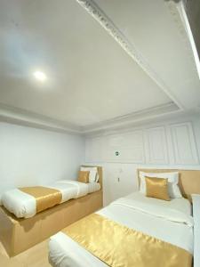 Una cama o camas en una habitación de My Home Cibubur