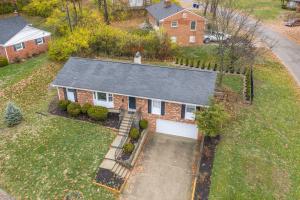 an aerial view of a brick house with a garage at The Terrace Timber House For 8 in Hamilton